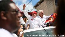Brazil's former President Luiz Inacio Lula da Silva, center, who is running for president again with the Workers' Party, campaigns in Salvador, Brazil, Friday, Sept. 30, 2022. Brazil's general elections are scheduled for Oct. 2. (AP Photo/Raphael Muller)