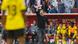 Edin Terzic stands holding his fist in the air in front of Dortmund's bench Edin Terzic stands holding his fist in the air in front of Dortmund's bench