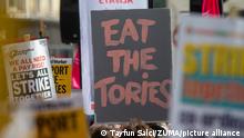 UK protesters burn energy bills over PM Truss' mini budget