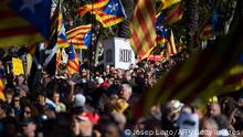 People holding Catalan pro-independence Estelada flags gather in Barcelona on October 1, 2022 to take part in a demonstration marking the fifth anniversary of a self-determination referendum organised by separatists despite being banned by the courts. - Five years after the banned referendum on independence, Catalan separatists appear to be even further from their goal of separating from Spain, with many feeling bitterly let down by their leaders. (Photo by Josep LAGO / AFP) (Photo by JOSEP LAGO/AFP via Getty Images)
