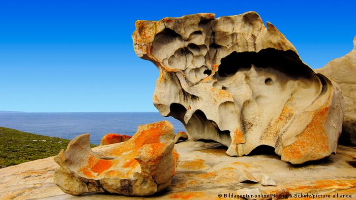 Rock formation against blue sky and sea