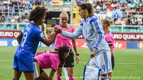 Milena Nikolic, of Bosnia, shakes hand with an Italian opponent before a match