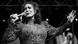 A black-and-white photo of Loretta Lynn performing in 2016 A black-and-white photo of Loretta Lynn performing in 2016