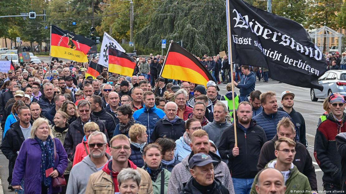 Far-right anti-government protesters with German flags on the streets in eastern Germany