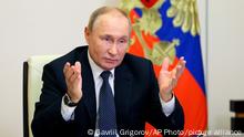 Russian President Vladimir Putin gestures during a meeting with the winners and finalists of the School Teacher of the Year national contest via videoconference at the Novo-Ogaryovo residence outside Moscow, Russia, Wednesday, Oct. 5, 2022. (Gavriil Grigorov, Sputnik, Kremlin Pool Photo via AP)