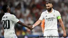 MADRID, SPAIN - OCTOBER 05: Vinicius Junior and Karim Benzema of Real Madrid interact after the UEFA Champions League group F match between Real Madrid and Shakhtar Donetsk at Estadio Santiago Bernabeu on October 05, 2022 in Madrid, Spain. (Photo by Denis Doyle/Getty Images)