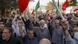 Pro-government demonstrators in Iran hold up their fists Pro-government demonstrators in Iran hold up their fists