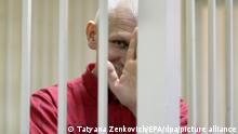 24/11/2011***
epa03013550 Belarussian human rights activist Ales Bialiatski (also transliterated as Alex Belyatsky) is seen in a cage in a court room during a court session in Minsk, Belarus, 24 November 2011. Ales Bialiatski is a leader of Viasna, a human rights group based in Minsk. He was arrested on 04 August 2011 and charged with tax evasion, after Polish and Lithuanian prosecutors gave Belorussian police information about Vesna's bank accounts in their countries. The court in Minsk on 24 November convicted him and gave him a four and a half year sentence in a maximum security jail. EPA/TATYANA ZENKOVICH