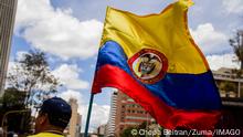 September 26, 2022, Bogota, Cundinamarca, Colombia: A demonstrator carries a Colombian flag during the first antigovernment protest against left-wing president Gustavo Petro and his initiative on a tax reform, in Bogota, Colombia, September 26, 2022. : /Long Visual Press Bogota Colombia - ZUMAvp1_ 20220926_zia_vp1_015 Copyright: xChepaxBeltranx