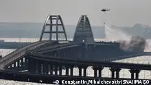 Russia Crimean Bridge Accident 8291782 08.10.2022 A helicopter drops water to stop fire on Crimean Bridge connecting Russian mainland and Crimean peninsula over the Kerch Strait, in Crimea, Russia. Russia s National Antiterrorism Committee NAC said on Saturday that a truck was blown up on the Crimean Bridge, which caused an inflammation of seven fuel tanks of a railway train and a partial collapse of two car spans. The traffic and movement of trains across the Kerch Strait was temporarily suspended. The movement of ships in the Kerch Strait did not stop despite a fire on the bridge. Konstantin Mihalchevskiy / Sputnik Republic of Crimea Russia PUBLICATIONxINxGERxSUIxAUTxONLY Copyright: xKonstantinxMihalchevskiyx