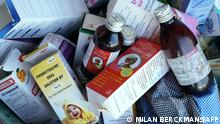 A photograph shows collected cough syrups in Banjul on October 06, 2022. - Indian authorities are investigating cough syrups made by a local pharmaceutical company after the World Health Organisation said they could be responsible for the deaths of 66 children in The Gambia. (Photo by MILAN BERCKMANS / AFP)