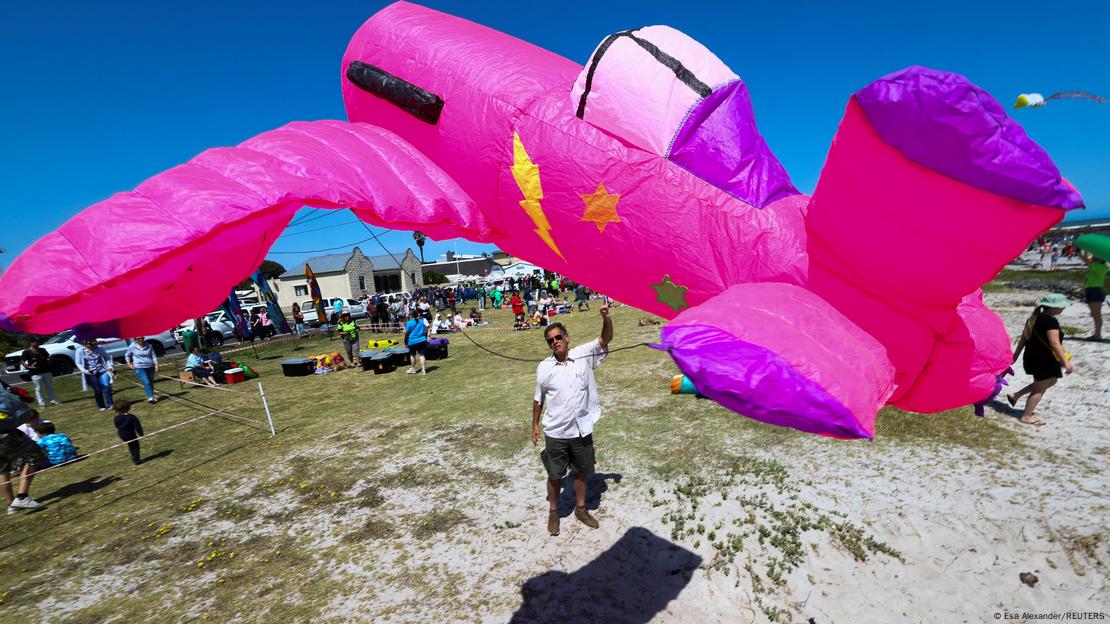 A man flies his kite during the 28th Cape Town International Kite Festival, an awareness-campaign for World Mental Health Day