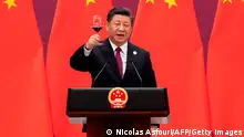 China's President Xi Jinping raises his glass and proposes a toast at the end of his speech during the welcome banquet for leaders attending the Belt and Road Forum at the Great Hall of the People in Beijing on April 26, 2019. (Photo by Nicolas ASFOURI and NICOLAS ASFOURI / POOL / AFP) (Photo credit should read NICOLAS ASFOURI/AFP via Getty Images)