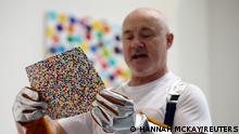 British artist Damien Hirst takes part in a burn event which is part of his latest NFT exhibition The Currency, in London, Britain, October 11, 2022. REUTERS/Hannah McKay