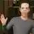 A metaverse avatar of Mark Zuckerberg waves to the camera