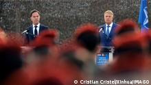  221012 -- CINCU ROMANIA, Oct. 12, 2022 -- Romanian President Klaus Iohannis R and Dutch Prime Minister Mark Rutte are seen at a military training center in Cincu, central Romania, on Oct. 12, 2022. The Netherlands is not against Romania s accession to Schengen, visiting Prime Minister Mark Rutte said on Wednesday. Photo by /Xinhua ROMANIA-CINCU-PRESIDENT-THE NETHERLANDS-PM-MEETING CristianxCristel PUBLICATIONxNOTxINxCHN