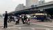 People ride scooters at an intersection near a bridge where social media videos earlier appeared to show smoke and protest banners in Beijing People ride scooters at an intersection near a bridge where social media videos earlier appeared to show smoke and protest banners in Beijing