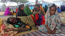 People affected by the worsening drought due to failed rain seasons, look on, at the Alla Futo camp for internally displaced people, in the outskirts of Mogadishu, Somalia September 23, 2022. REUTERS/Feisal Omar