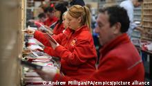 Christmas Mail - Scotland. Royal Mail worker Paula Carey sorts mail at the Royal Mail's Sorting Office in Turner Road, Glasgow, where postal workers are handling some of the millions of items of Christmas mail on what is expected to be one of their busiest day of the year. URN:29490231