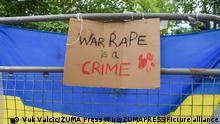 May 28, 2022, London, England, United Kingdom: 'War rape is a crime' sign and a Ukrainian flag on a fence outside the embassy. Demonstrators gathered outside the Embassy of Russia in London in protest against the rape of Ukrainian women during the Russian war in Ukraine. (Credit Image: Â© Vuk Valcic/ZUMA Press Wire