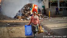 A woman walks in the streets left empty by a general strike in Port-au-Prince, Haiti, September 28, 2022. - Officials described a humanitarian catastrophe in Haiti to the UN Security Council Monday, as the nation hits new levels of desperation after two weeks of violence and attacks on food aid warehouses.
Protests and looting have rocked the already unstable country since September 11, when Prime Minister Ariel Henry announced a fuel price hike; he says subsidies are too expensive for one of the world's poorest states. (Photo by Richard Pierrin / AFP)