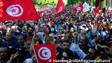 People take part in a demonstration by the National Salvation Front against President Kais Saïed at Avenue Habib Bourguiba in Tunis, Tunisia, Saturday Oct. 15, 2022.(AP Photo/Hassene Dridi)