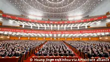 In this photo released by Xinhua News Agency, delegates attend a preparatory meeting ahead of the 20th National Congress of the Communist Party of China held at the Great Hall of the People in Beijing on Saturday, Oct. 15, 2022. China on Sunday is opening a twice-a-decade party conference at which leader Xi Jinping is expected to receive a third five-year term that breaks with recent precedent and establishes himself as arguably the most powerful Chinese politician since Mao Zedong. (Huang Jingwen/Xinhua via AP)
