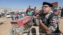 (180628) -- BEIRUT, June 28, 2018 () -- Syrian refugees pack and load their family belongings with the help of Lebanese security forces in the village of Arsal, Lebanon, on June 28, 2018. More than 400 Syrian refugees have permission from the Syrian authority to return their home from Arsal to Qalamoun area in the western Damascus countryside.(/Bilal Jawich)(yg)