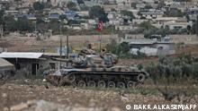 Turkish troops are pictured in the area of Kafr Jannah on the outskirts of the Syrian town of Afrin on October 18, 2022 as the Hayat Tahrir al-Sham (HTS) jihadist group advances towards Syrian opposition-held areas in the northern Syria. - Hayat Tahrir al-Sham, Al-Qaeda's former Syria affiliate, is gaining ground from rival rebels in Syria's Turkish-held north on the heels of some of the deadliest inter-rebel fighting in the region in years. (Photo by Bakr ALKASEM / AFP)