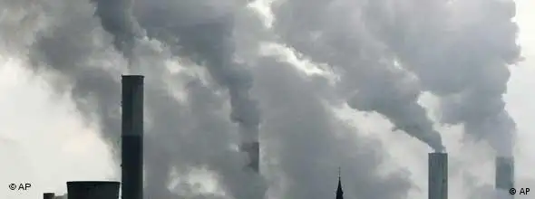 ###ACHTUNG NICHT FÜR CMS-FLASHGALERIEN### ** FILE ** In this Feb. 25, 2008 file photo the tower of a church is seen between the smoke billowing chimneys of the brown coal power plant Frimmersdorf near Duesseldorf, Germany. Leading industrial nations on Tuesday, July 8, 2008, endorsed halving world emissions of greenhouse gases by 2050, Japan's prime minister said, edging forward in the battle against global warming but stopping short of tough, nearer-term targets. (AP Photo/Frank Augstein)