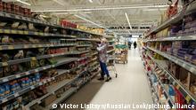 Supermarket in Riga's Bolderaja microdistrict. A woman chooses a product.