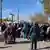 People gather at the port of Kherson for evacuation