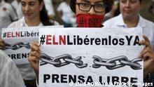 Journalists protest on May 27, 2016, in Cali, Colombia, calling for the release of Diego D'Pablos and cameraman Carlos Melo, both journalists from Noticias RCN. Colombian Defense Minister Luis Carlos Villegas confirmed that the National Liberation Army (ELN) guerrillas is holding Colombian journalists Diego D'Pablos and Carlos Melos for Noticias RCN, and until they not free them peace talks with this guerrilla will not resume. Also, a prominent Spanish-Colombian journalist who went missing last weekend and according to Colombia's government was kidnapped by leftist rebels has been freed, a Catholic archbishop said Friday. The correspondent, Salud Hernandez-Mora, was handed over and is free at this very moment, Gabriel Villa, the archbishop of Ocana, told television channel Caracol, after the government accused the communist guerrillas of the National Liberation Army of abducting her. / AFP / LUIS ROBAYO (Photo credit should read LUIS ROBAYO/AFP via Getty Images)
