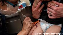 SEATTLE, WA - JUNE 21: A 20-month-old baby receives the first dose of the Pfizer Covid-19 vaccination at UW Medical Center - Roosevelt on June 21, 2022 in Seattle, Washington. Covid-19 vaccinations for children younger than 5 began today across the U.S. (Photo by David Ryder/Getty Images)