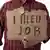Чоловік із надписом "I need Job" на картонці