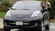 A man driving a Nissan Volt A man driving a Nissan Volt