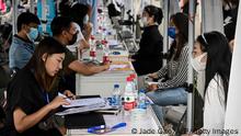 The photo taken on August 26, 2022 shows young people attending a job fair in Beijing. (Photo by Jade Gao / AFP) (Photo by JADE GAO/AFP via Getty Images)