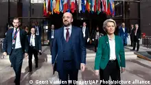 European Council President Charles Michel, center left, and European Commission President Ursula von der Leyen, center right, walk together prior to a media conference at an EU summit in Brussels, Friday, Oct. 21, 2022. European Union leaders are gathered Friday to take stock of their support for Ukraine after President Volodymyr Zelenskyy warned that Russia is trying to spark a refugee exodus by destroying his war-ravaged country's energy infrastructure. (AP Photo/Geert Vanden Wijngaert)
