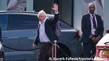 Former Prime Minister Boris Johnson arrives at Gatwick Airport in London, after travelling on a flight from the Caribbean, following the resignation of Liz Truss as Prime Minister, Saturday Oct. 22, 2022. (Gareth Fuller/PA via AP)