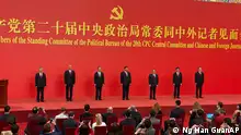 New members of the Politburo Standing Committee, from left, Li Xi, Cai Qi, Zhao Leji, President Xi Jinping, Li Qiang, Wang Hunting, and Ding Xuexiang are introduced at the Great Hall of the People in Beijing, Sunday, Oct. 23, 2022. (AP Photo/Ng Han Guan)