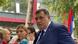 Na fotografiji je Milorad Dodik, predsjednik Republike Srpske, koji daje izjavu novinarima. Iza njega se vidi srpska zastava, a ispred njega su mikrofoni raznih medijskih kuća. Atmosfera je formalna. Na fotografiji je Milorad Dodik, predsjednik Republike Srpske, koji daje izjavu novinarima. Iza njega se vidi srpska zastava, a ispred njega su mikrofoni raznih medijskih kuća. Atmosfera je formalna.