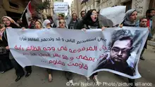 21/02/2012***
FILE - Egyptian protesters shout slogans against the then ruling military council during a rally in support of then member of Parliament Zyad el-Elaimy outside the Egyptian parliament in Cairo, Egypt, Feb. 21, 2012. An Egyptian court on Wednesday, Nov. 17, 2021, sentenced former lawmaker el-Elaimy, a prominent human rights lawyer, to five years in prison for his conviction on charges that rights advocates have decried as baseless and politically motivated. The court found el-Elaimy guilty of conspiring to commit crimes with an outlawed group -- a reference to the Muslim Brotherhood, which Egypt has banned as a terrorist organization. The banner shows el-Elaimy with Arabic that reads, your hands raised in front of injustice will move future generations. (AP Photo/Amr Nabil, File)