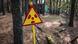 Ionizing radiation warning sign in Pripyat city of Chernobyl Nuclear Power Plant Zone of Alienation Ionizing radiation warning sign in Pripyat city of Chernobyl Nuclear Power Plant Zone of Alienation