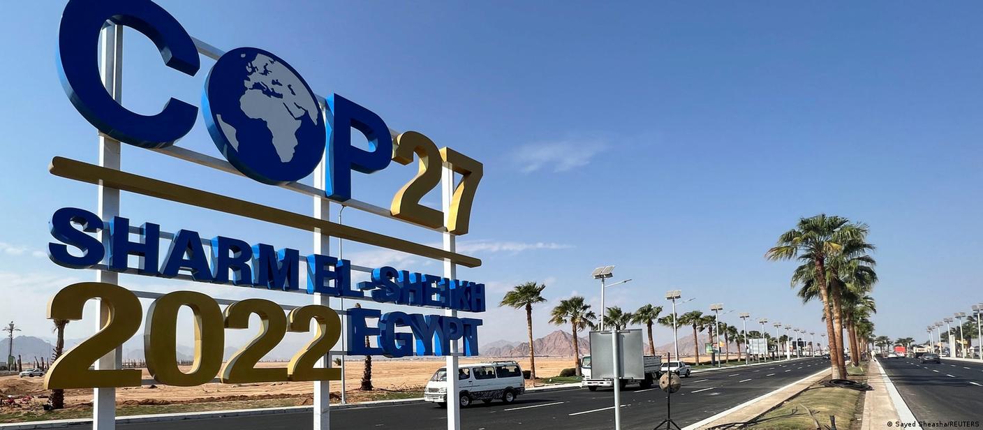 View of a COP27 sign on the road leading to the conference area in Sharm el-Sheikh