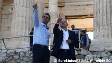  October 27, 2022, Athens, Greece: Greek Prime Minister Kyriakos Mitsotakis and German Chancellor Olaf Scholz talk each other as they walk in front of the ancient Parthenon Temple at the Acropolis hill during a visit, in Athens. Athens Greece - ZUMAe114 20221027_zaa_e114_001 Copyright: xEurokinissix