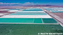 Aerial view of brine ponds and processing areas of the lithium mine of the Chilean company SQM (Sociedad Quimica Minera) in the Atacama Desert, Calama, Chile, on September 12, 2022. - The turquoise glimmer of open-air pools meets the dazzling white of a seemingly endless salt desert where hope and disillusionment collide in Latin America's lithium triangle. A key component of batteries used in electric cars, demand has exploded for the white gold found in Argentina, Bolivia and Chile in quantities larger than anywhere else in the world. (Photo by Martin BERNETTI / AFP)