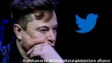 ANKARA, TURKIYE - OCTOBER 06: In this photo illustration, the image of Elon Musk is displayed on a computer screen and the logo of twitter on a mobile phone in Ankara, Turkiye on October 06, 2022. Muhammed Selim Korkutata / Anadolu Agency