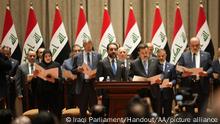 BAGHDAD, IRAQ - OCTOBER 27: Mohammed Shia al-Sudani (front R), who was assigned to form the countryÄôs new government after months of political instability, and new ministers take oath after parliament gives confidence vote to Cabinet led by Mohammed Shia al-Sudani, in Baghdad, Iraq on October 27, 2022. Iraqi Parliament/Handout / Anadolu Agency