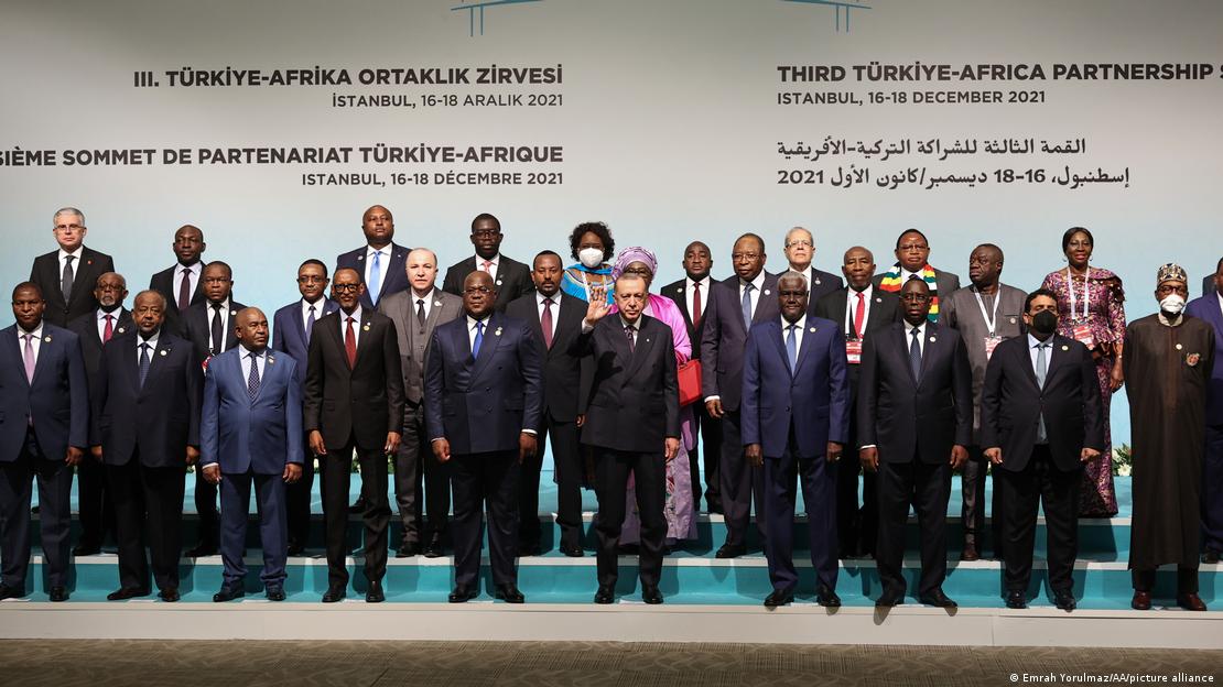 Turkish President Recep Tayyip Erdogan stands in the middle of other African leaders
