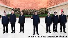 In this photo released by Xinhua News Agency, Chinese President Xi Jinping, center, delivers a speech after visiting an exhibition on the history of Yan'an city's 13 years (1935-1948) as the headquarters of the CPC Central Committee at the Yan'an Revolutionary Memorial Hall in Yan'an, northwestern China's Shaanxi Province on Oct. 27, 2022. From left the members of the standing committee of the Politburo of the CPC central committee including Li Xi, Cai Qi, Zhao Leji, President Xi Jinping, Li Qiang, Wang Huning, and Ding Xuexiang. (Yan Yan/Xinhua via AP)